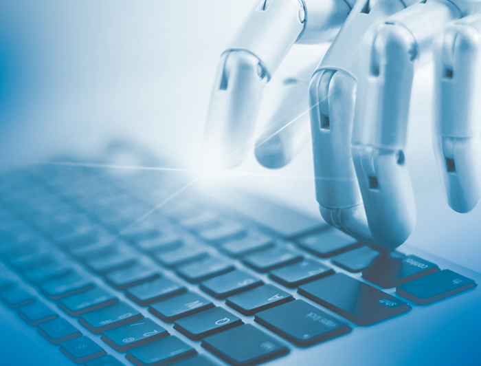Stock image of a robot typing