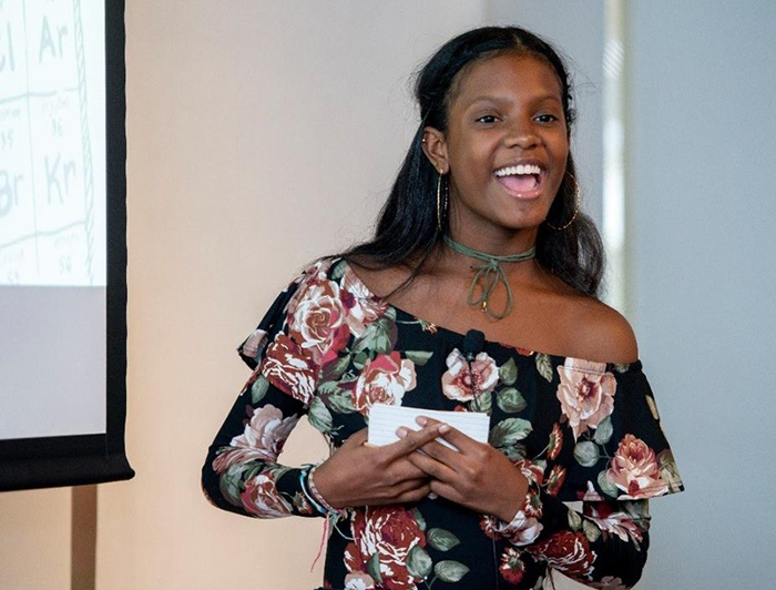 student giving a science fair presentation at massachusettes general