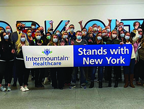 Intermountain Healthcare, Holding a sign - Stand with New York