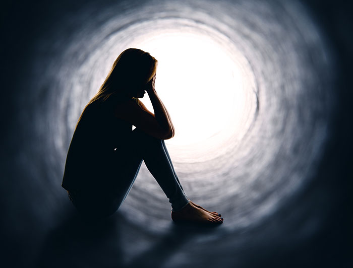 silhouette of person in tube