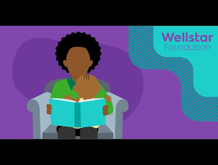illustration depicts black parent reading book to baby seated on lap.