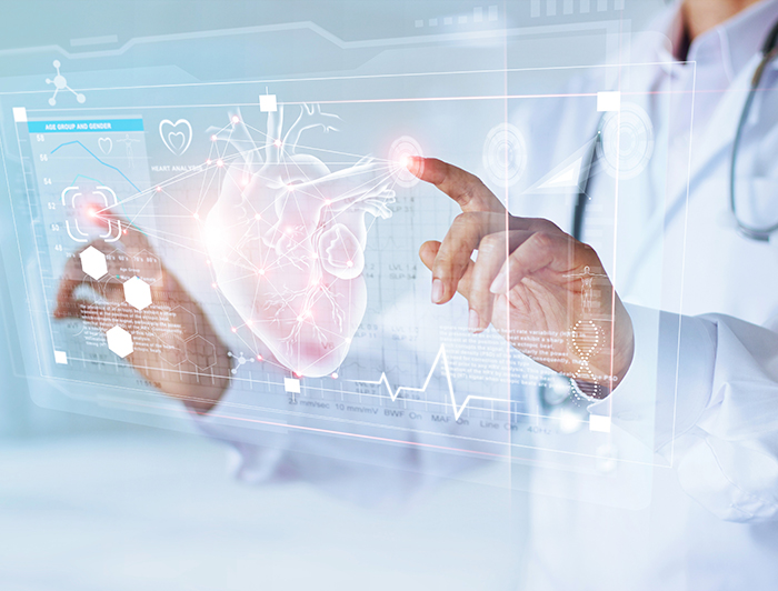 stock image of doctor hands gesturing at hologram showing heart image