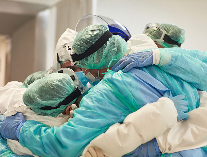 Medical person swabbing a person in a car