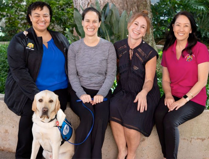 Nalu and handler with Tripler team