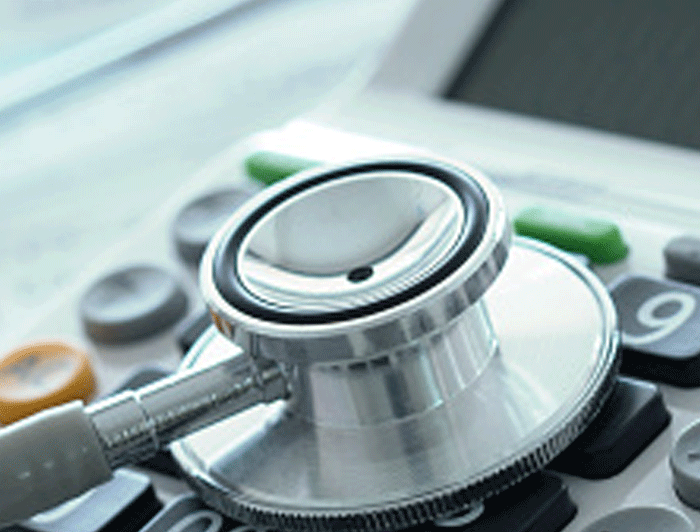 Stethoscope on top of a calculator