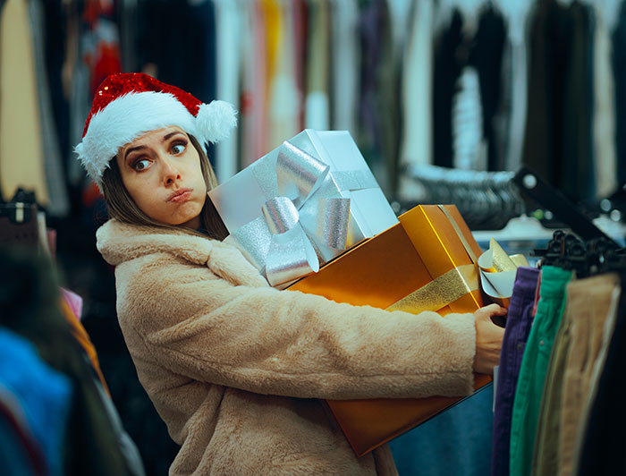 Stressfull holiday shopping - woman carrying packages