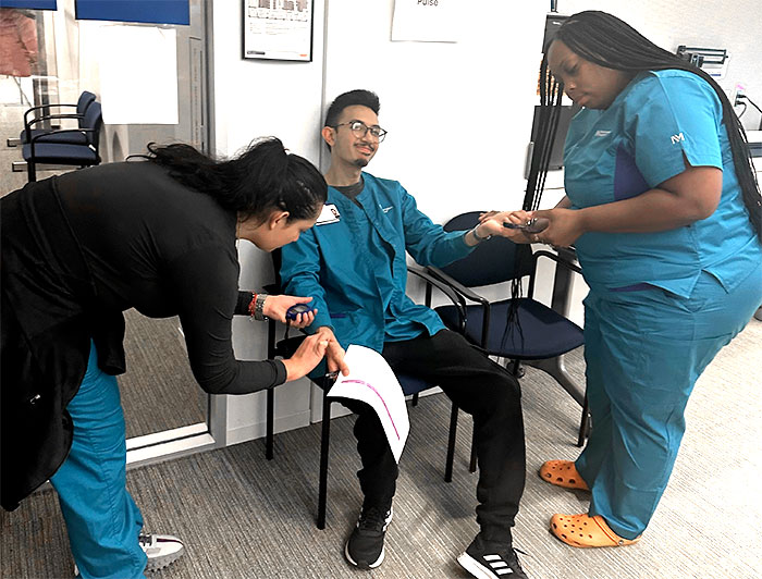 Northwestern nursing program participants practice their skills on each other