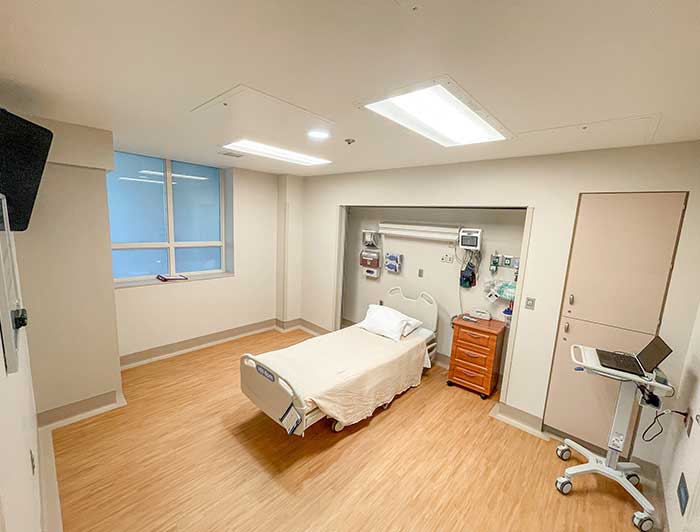 empty patients room with a medical bed