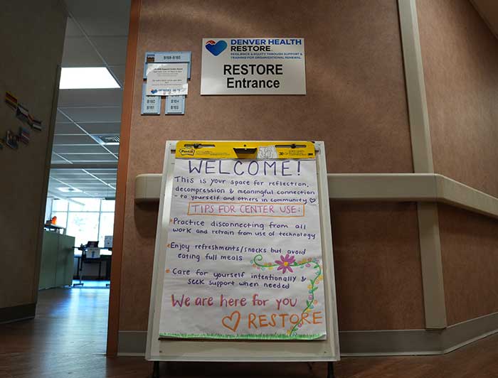 Hand written sign that says: Welcome! This is your space for reflection, decompression & meaningful connection - to yourself and other in the community - HEART picture