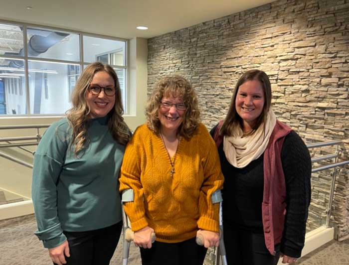 Group photo of Kim now that she is back to PT/OT with her therapists, Kayla and Laura.
