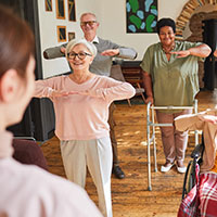 Adults doing arm exercises