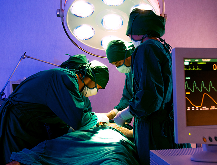 Maui Memorial Medical Center. A surgical team is shown operating in an operating room
