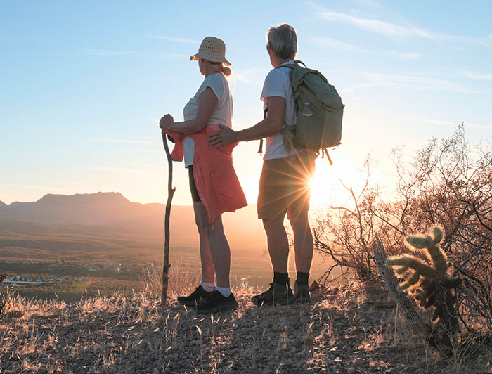 Telling the Hospital Story: Monadnock Community Hospital's Wellness Wednesday campaign shares tips for peak health. A couple in hiking gear stands on trail gazing at the horizon