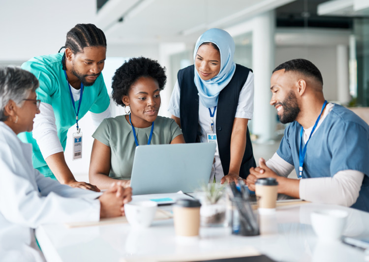Medical staff gathered around a table