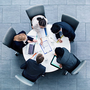 Business people gathered around a table
