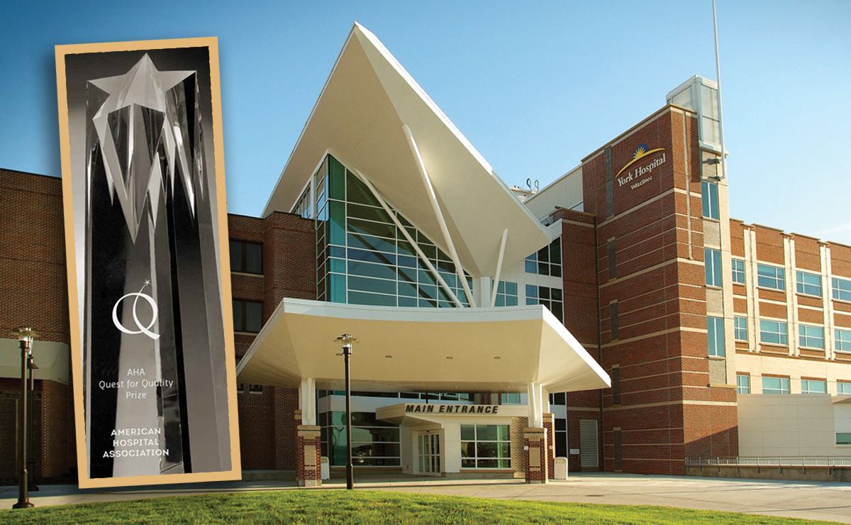 4 Leaders in Improving Quality Care. The AHA Quest for Quality Prize displayed in front of the hospital entryway of winner WellSpan Health's York Hospital.