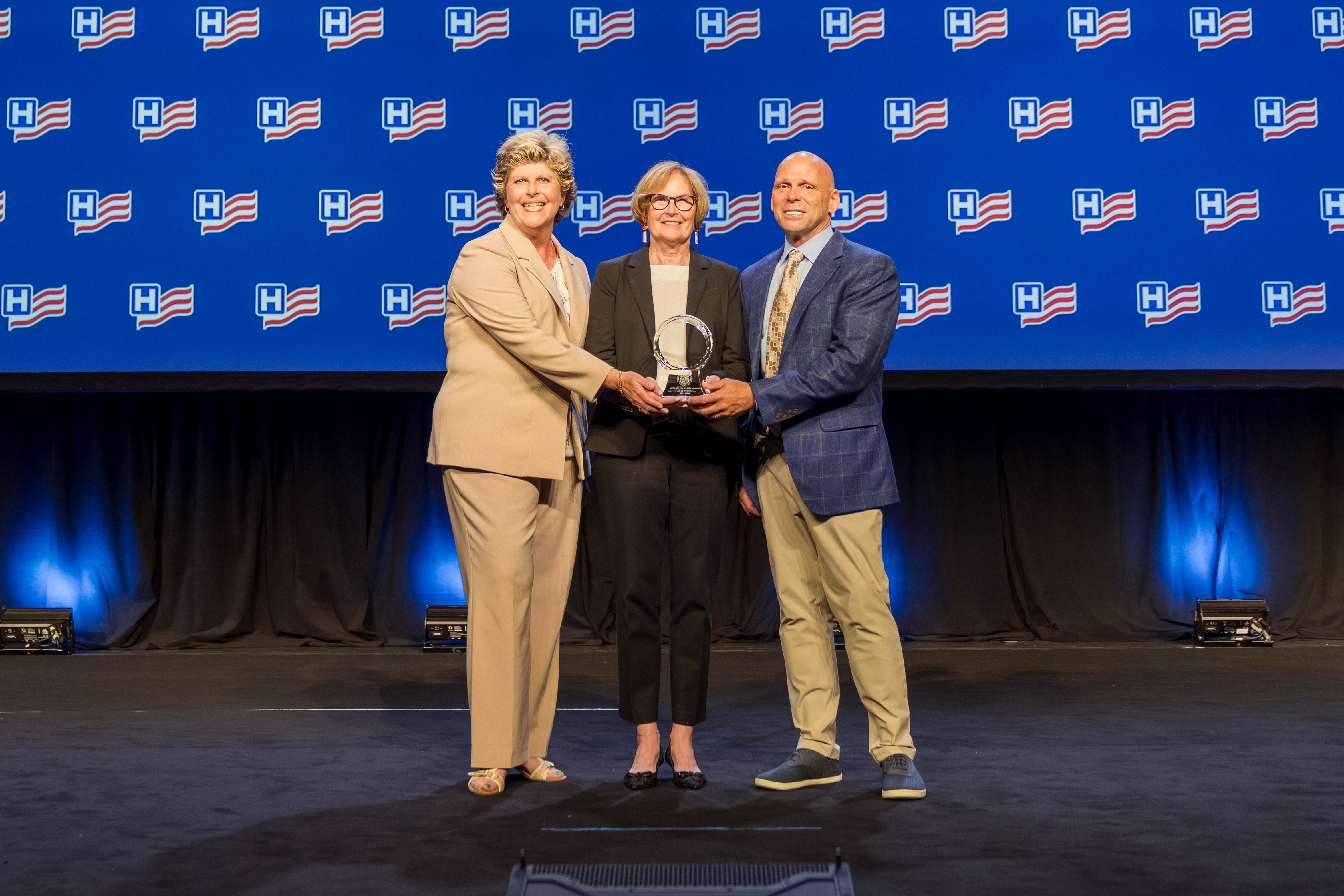 Gilchrist Hospice Care accept their Circle of Life Award at the 2025 AHA Leadership Summit.