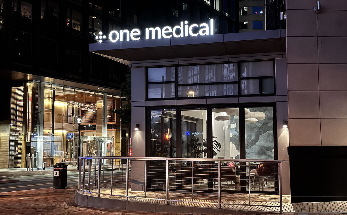 Cleveland Clinic and Amazon One Medical Partner to Expand Primary Care. A One Medical sign above an urban clinic and office.