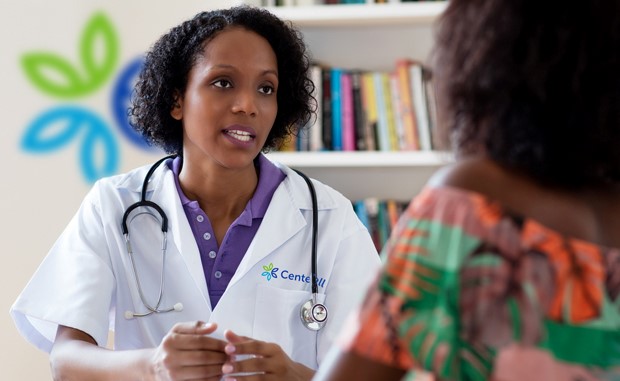 Humana Plans Primary Care Expansion in Medically Underserved Areas. A clinician talks with a patient.