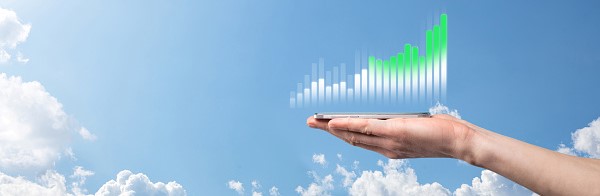 Implementing a Proven Road Map to Drive Sustainable Growth. Against a sunny blue sky background, a hand presents a bar chart showing growth over time.