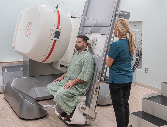 MUSC’s First Upright MRI Is Changing Lives, Thanks to One Patient’s Vision. A clinician positions a patient for an MRI.