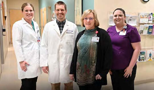 MaineGeneral staff standing in a hospital hallway.