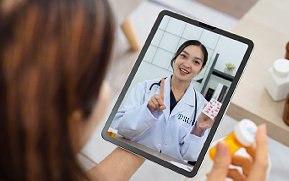 Rush Health Launches National Direct-to-Consumer Telehealth Membership. A Rush University System for Health clinician displayed on a table screen via a telehealth app helps a patient identify her correct dosage of prescription medication.