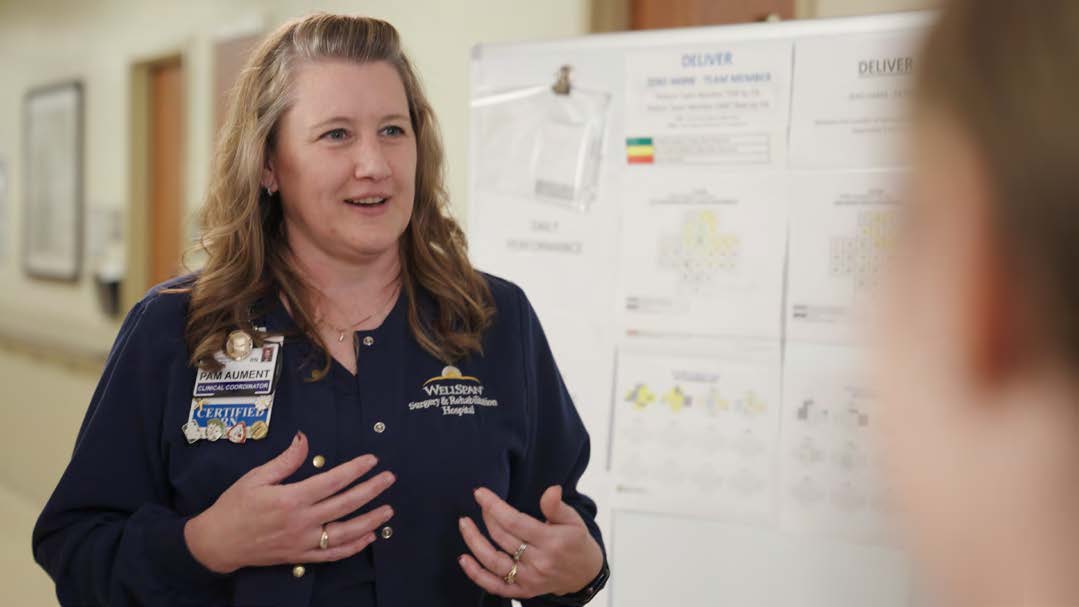 WellSpan Health staff member explaining progress made through the use of Artisight system harnessing artificial intelligence (AI) to improve patient safety and alleviate staff burnout through a revolutionary system empowering nurses and nursing assistants to monitor patients and perform certain routine tasks virtually.