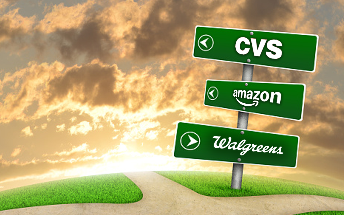 Where Are Amazon, CVS and Walgreens Headed in Health Care? Sunset at a crossroads with a signpost that has CVS, Amazon, and Walgreens signs with arrows pointing in different directions.