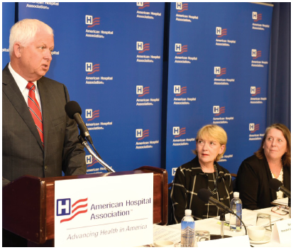 Nancy Agee and speaker at podium