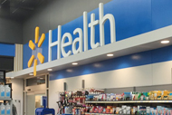 Walmart, Transcarent Team Up to Woo Self-Insured Employers. Walmart Health sign in a Walmart store.