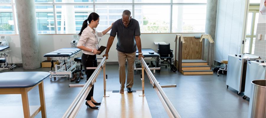 Patient doing rehabilitative exercise with clinician 