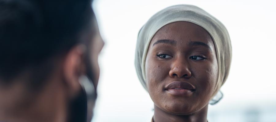 A Black woman with a headscarf