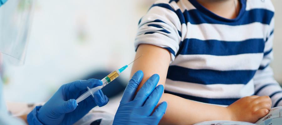 Syringe near boy's arm