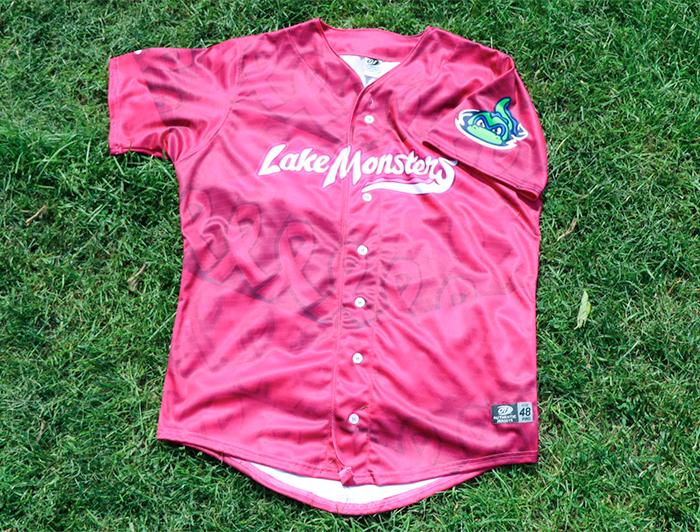 Pink satin Lake Monsters jersey on grass
