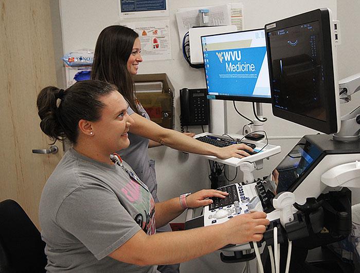 A nurse and WVU ultrasound tech work together