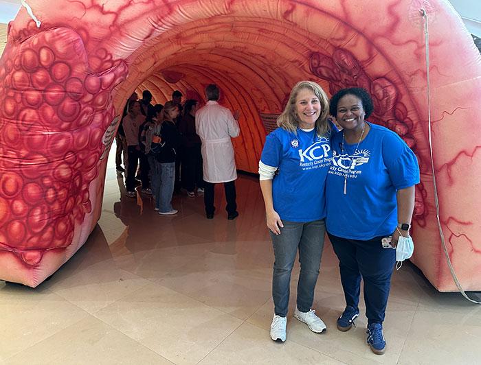Chandler staffers pose outside the entrance to the giant colon