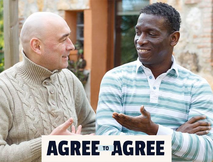Agree to Agree poster shows two men stand side by side talking. 