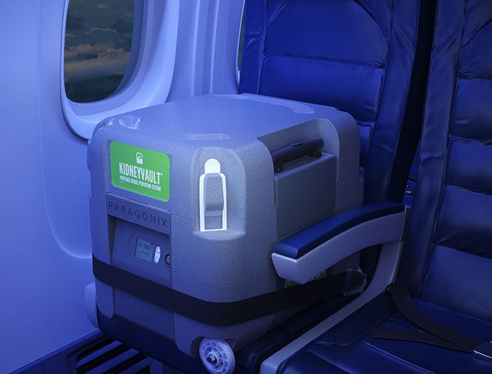 KidneyVault device sits strapped into an airplane seat