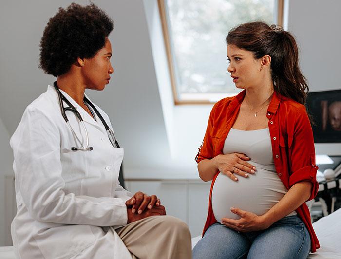 A pregnant woman consults with a female physician