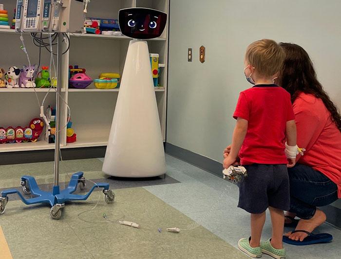 A young patient interacts with the UMass Memorial Children's hospital robot