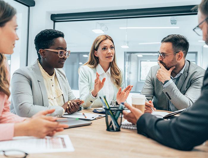Stock phot of a diverse team of professionals in a conference room