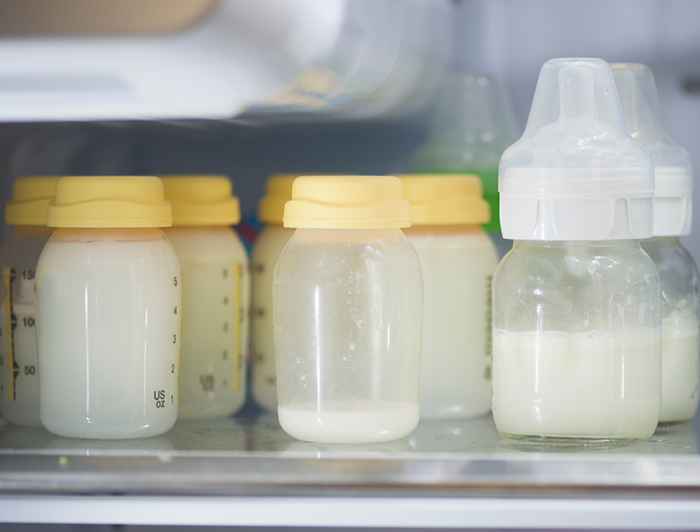 Stock image of refrigerated expressed breast milk in bottles